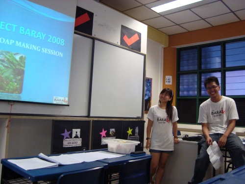 Siew Chien and Jonathan presenting on soap-making in Cambodia